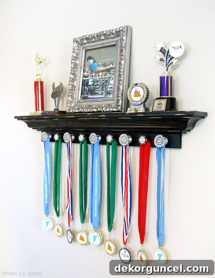 An adorable and functional display for kids' trophies and medals, combining shelving with decorative knobs.