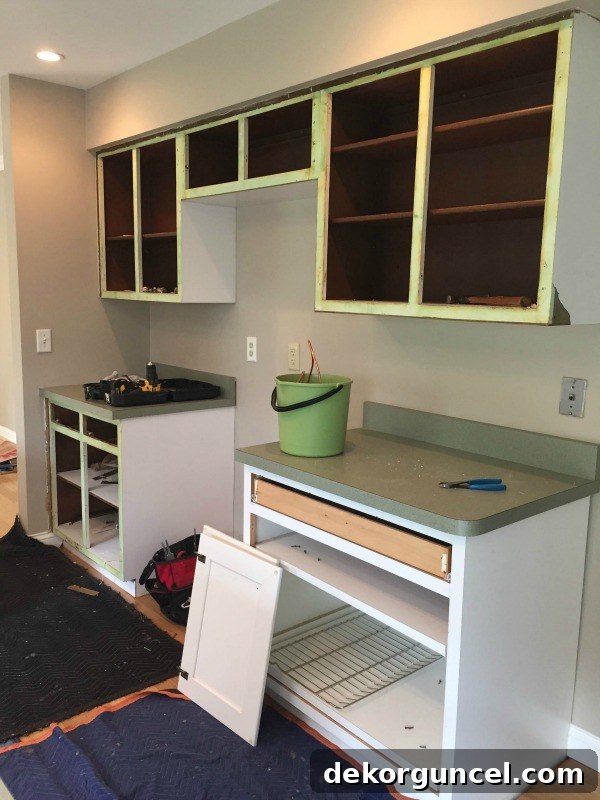 My Go-To Affordable Granite 2 Kitchen cabinet refacing in progress, new maple doors being installed