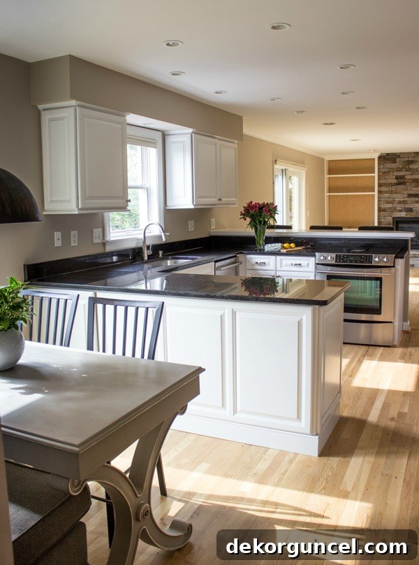 My Go-To Affordable Granite 12 After photo of a budget-friendly kitchen remodel showcasing refaced cabinets and new granite countertops