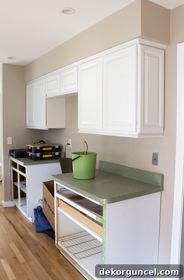 My Go-To Affordable Granite 3 Detailed shot of kitchen cabinet refacing installation, highlighting new doors and trim