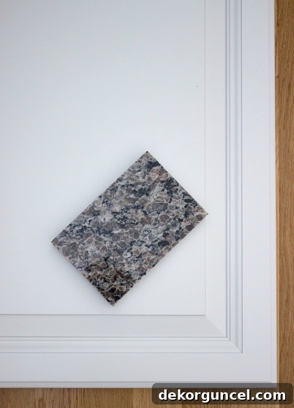 My Go-To Affordable Granite 6 Kitchen featuring New Caledonia Oyster Pearl granite paired with elegant white cabinets
