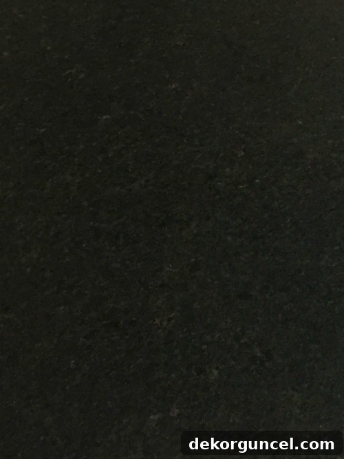 My Go-To Affordable Granite 9 Close-up of Black Pearl granite, highlighting its subtle variations and flecks of color