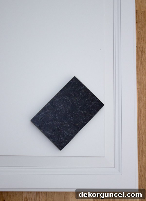 My Go-To Affordable Granite 10 Black Pearl (Black Uba Tuba) granite countertops complementing white kitchen cabinets for a sleek look