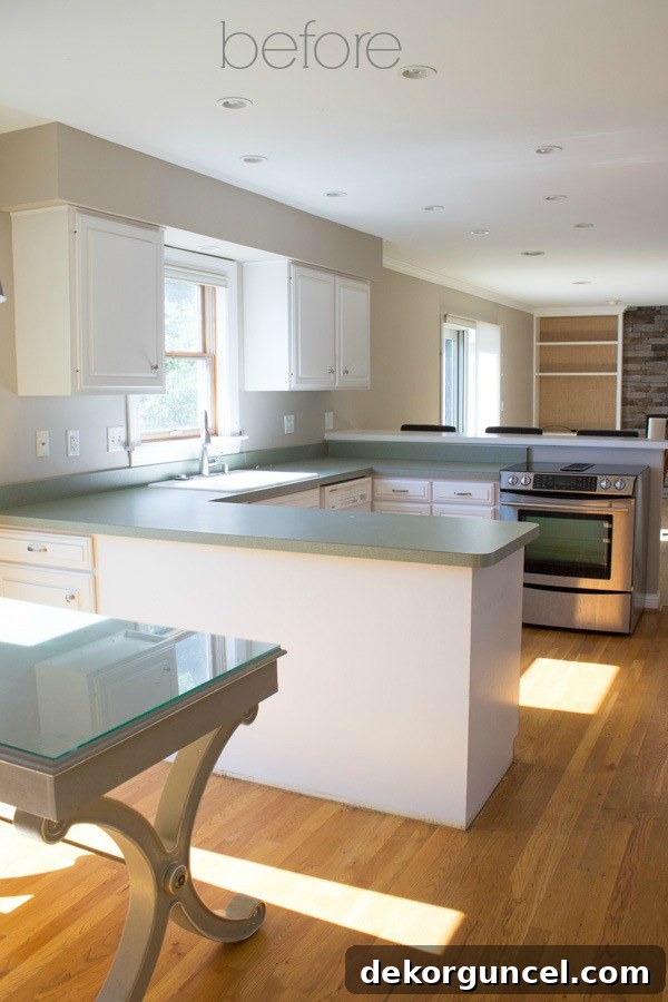 Before photo of a dated kitchen with old cabinets and appliances, showcasing the initial state prior to cabinet refacing.