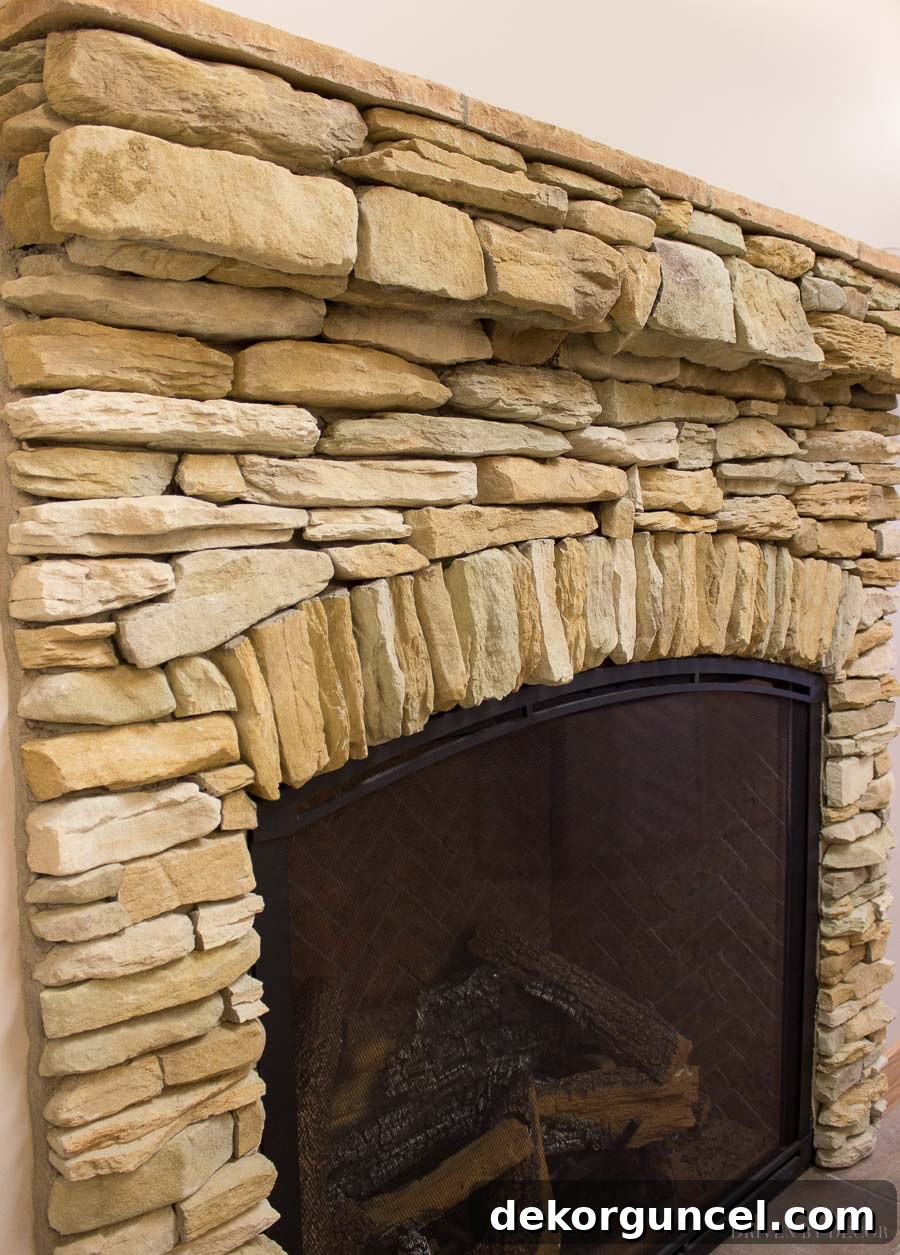 Stone Fireplace Designs Youll Love 10 Loving the arched stone accent on this stone veneer fireplace