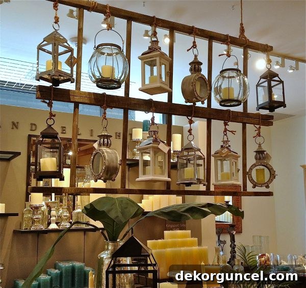 Elegant Pottery Barn lanterns displayed hanging from ropes, showcasing a stylish in-store decor arrangement.