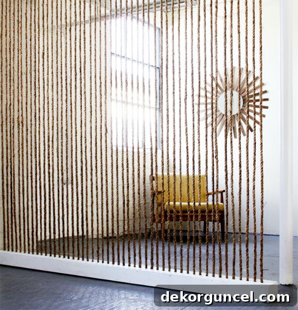 Thick rope meticulously arranged to create a unique and textural dividing wall, ideal for open-plan spaces.