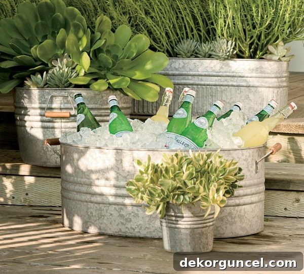 Galvanized metal tub filled with ice and drinks, serving as a stylish cooler for an outdoor party.
