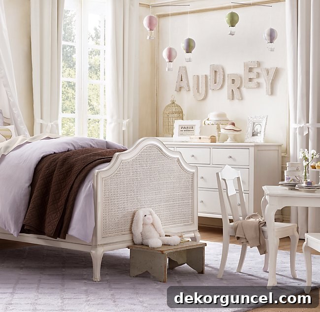 Decorative Letters: Top Sources and Creative Home Decor Ideas 5 Adorable decorative letters spelling out a child's name, creating a personalized and charming feature in a little girl's room.