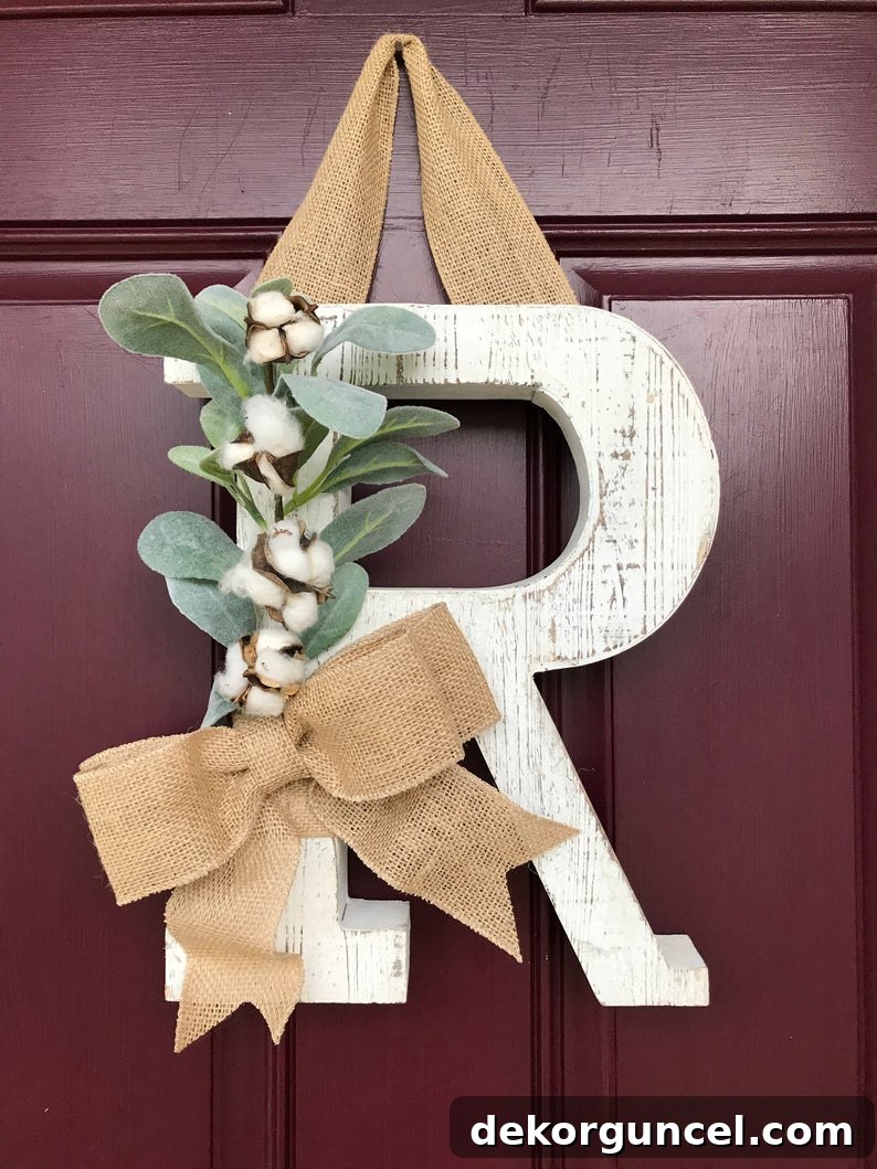 Decorative Letters: Top Sources and Creative Home Decor Ideas 9 A beautifully whitewashed wooden decorative letter hung on a front door, creating a charming and personalized welcome.