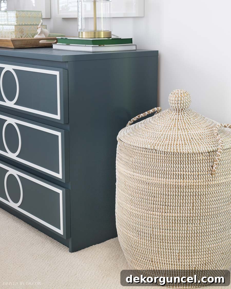 10 Clever Ways to Style Your Home With Baskets 14 This super cute basket is thoughtfully repurposed as a stylish and functional laundry hamper, enhancing room aesthetics.