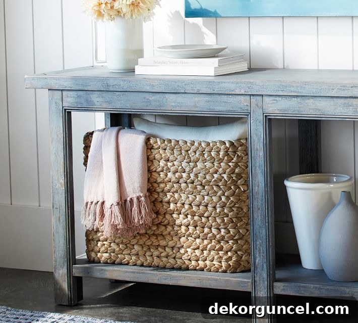 10 Clever Ways to Style Your Home With Baskets 9 A functional and stylish seagrass basket neatly tucked under a console table, offering elegant storage.