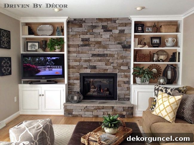 Family room with stacked stone fireplace - a modern, cozy family room after renovation