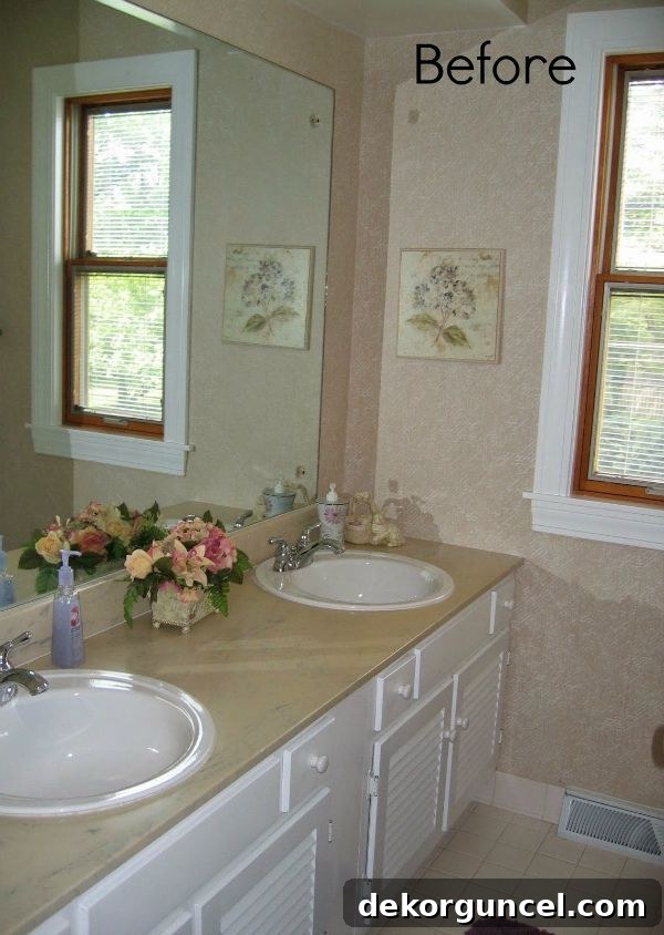 Girls Bath Before - an outdated bathroom with basic fixtures and finishes