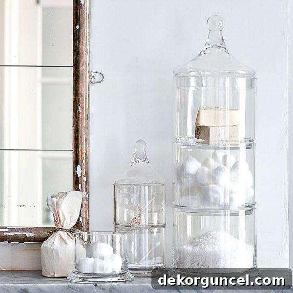 Elevate Your Home with Apothecary Jars 5 Stacked apothecary jars holding cotton balls and other bathroom items