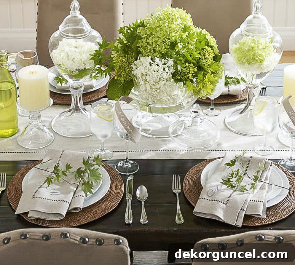 Elevate Your Home with Apothecary Jars 7 Two apothecary jars filled with floating flowers as part of a table centerpiece