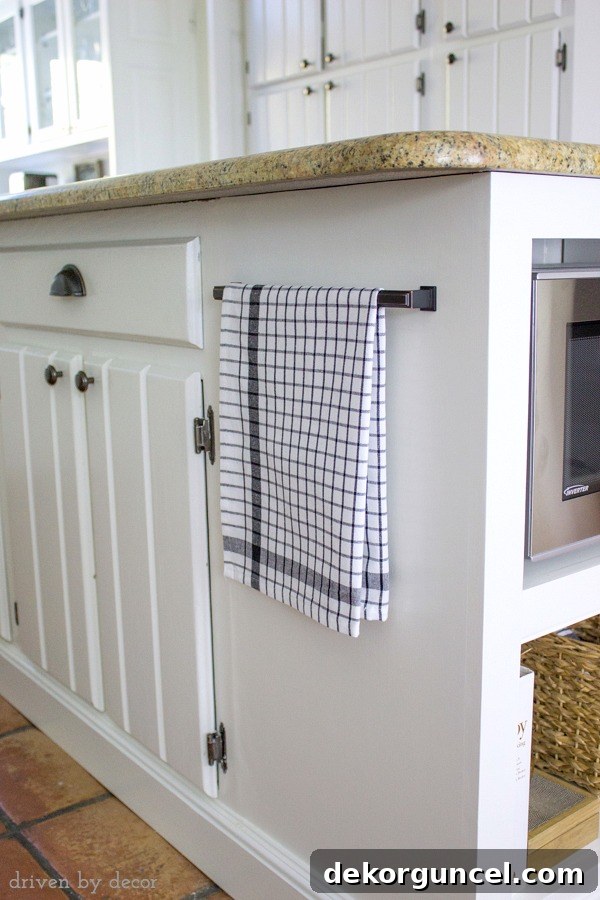 Drawer handle used to hold towel on kitchen island