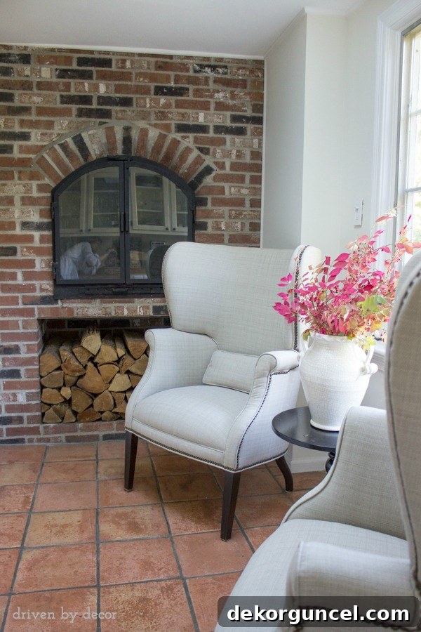 Two chair seating area next to kitchen fireplace