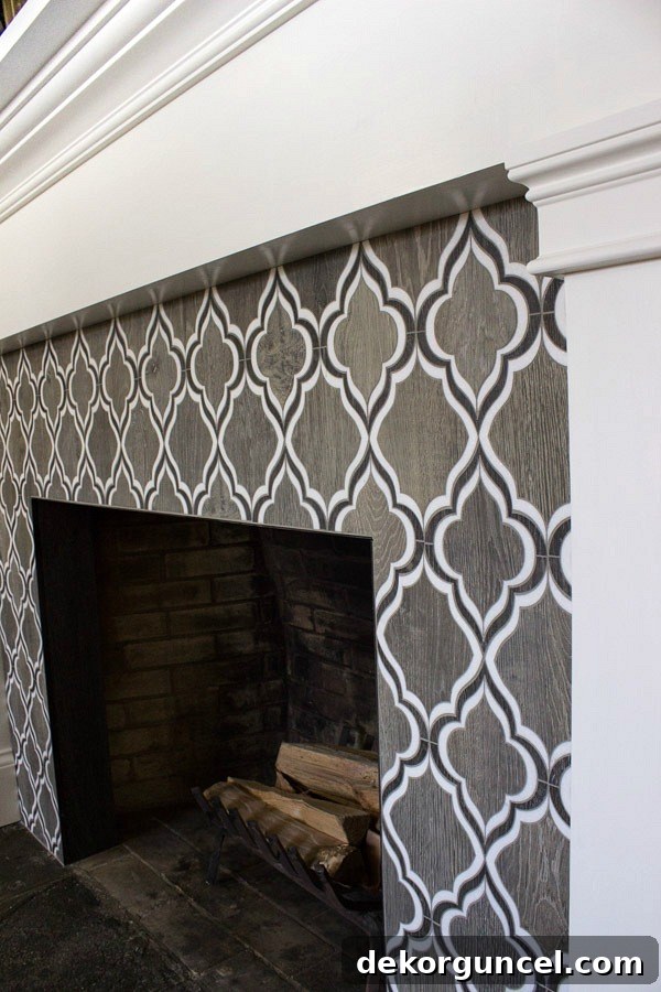 Detailed shot of the Walker Zanger Sterling Row Wingtip tile, highlighting its beauty on the fireplace