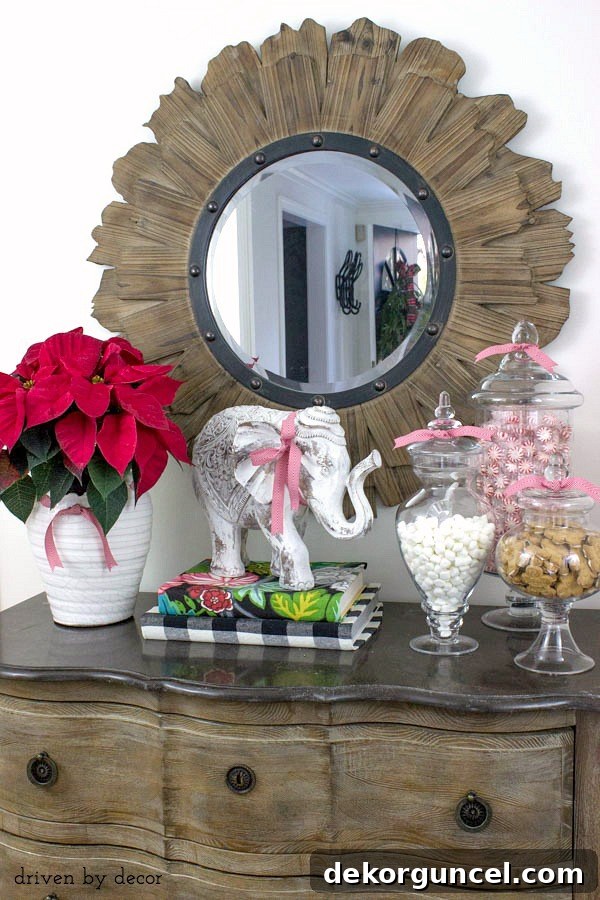 Quintessential New England Christmas Style 4 Our foyer chest, beautifully decorated for the holidays, featuring a trio of apothecary jars abundantly filled with delicious festive treats and candies.