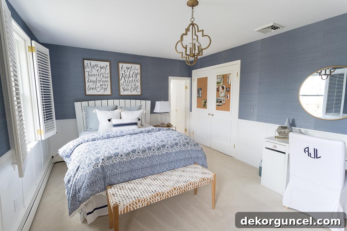 Blue grasscloth wallpaper in a bedroom