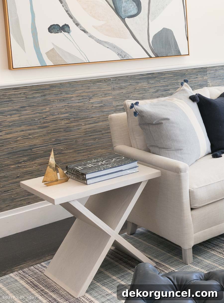 Gorgeous navy blue grasscloth wallpaper! Love how they used it in small amounts below the chair rail.