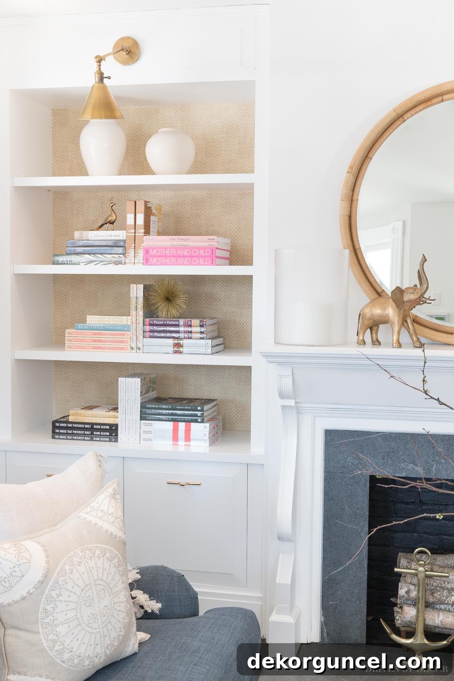Gorgeous grasscloth wallpaper on the back of the bookcase adds so much to this space!