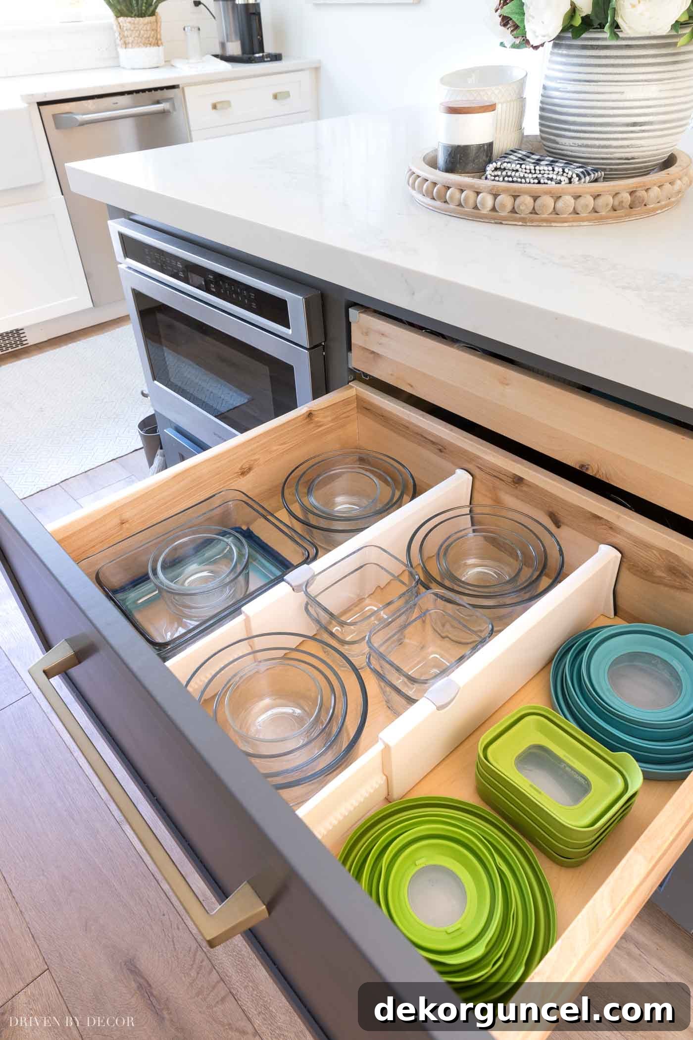 8 Genius Budget Kitchen Hacks 2 Organize food storage containers effectively with drawer dividers – a top kitchen organization tip for a clutter-free space!