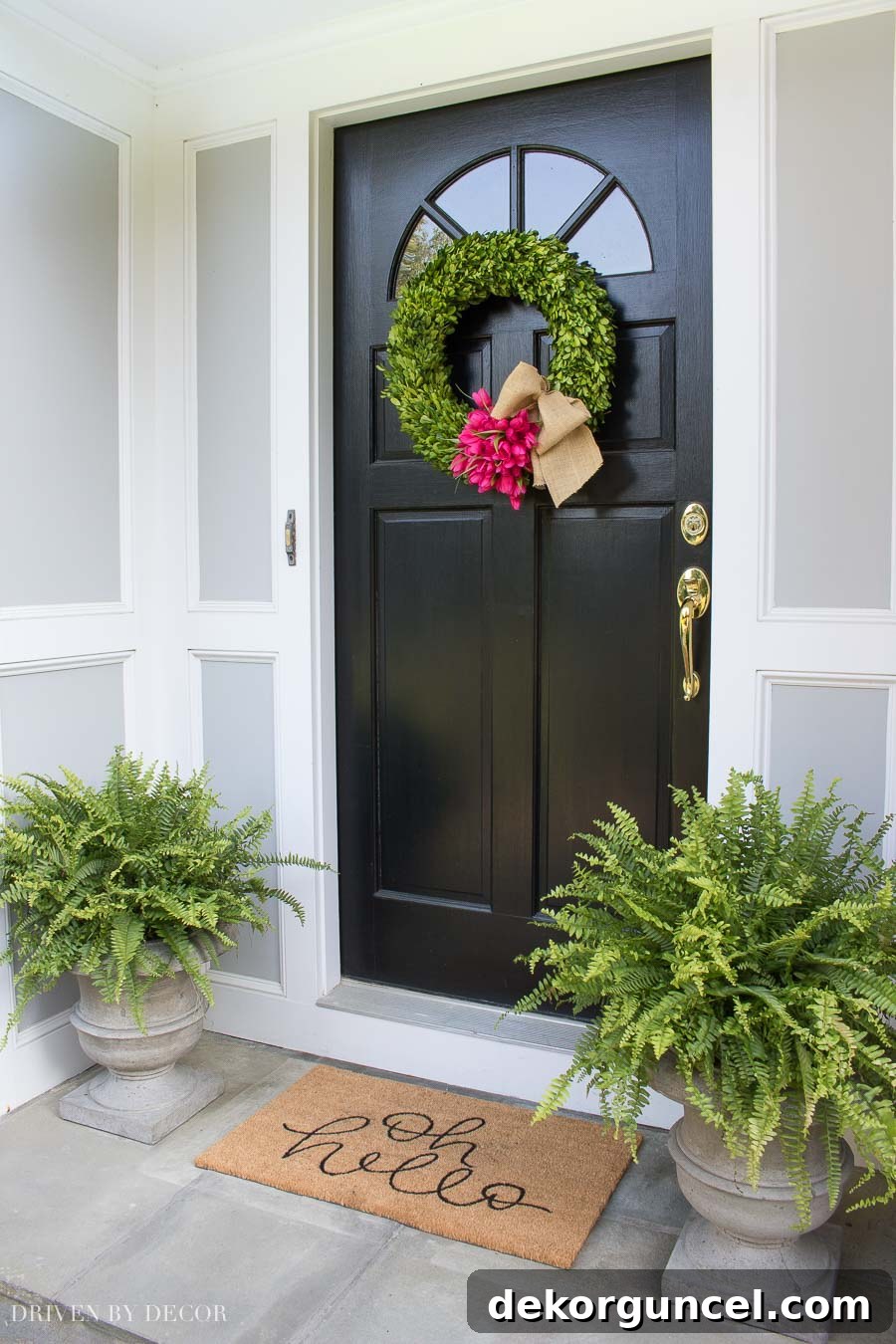 Top Spring Wreaths for a Welcoming Front Door 10 Loving the simple spring door decorations of a boxwood wreath with tulips, complemented by planters with Boston ferns.