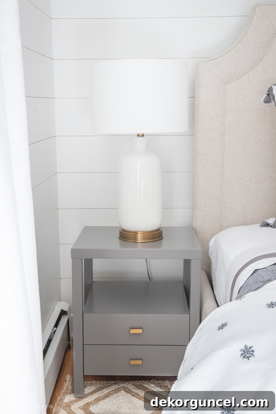 This narrow gray bedroom nightstand proves to be an ideal choice for compact living spaces, combining functionality with sleek design.