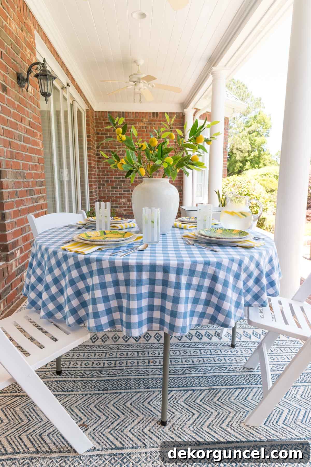 Stylish outdoor dining space created with a simple folding table and four comfortable folding chairs on a patio.