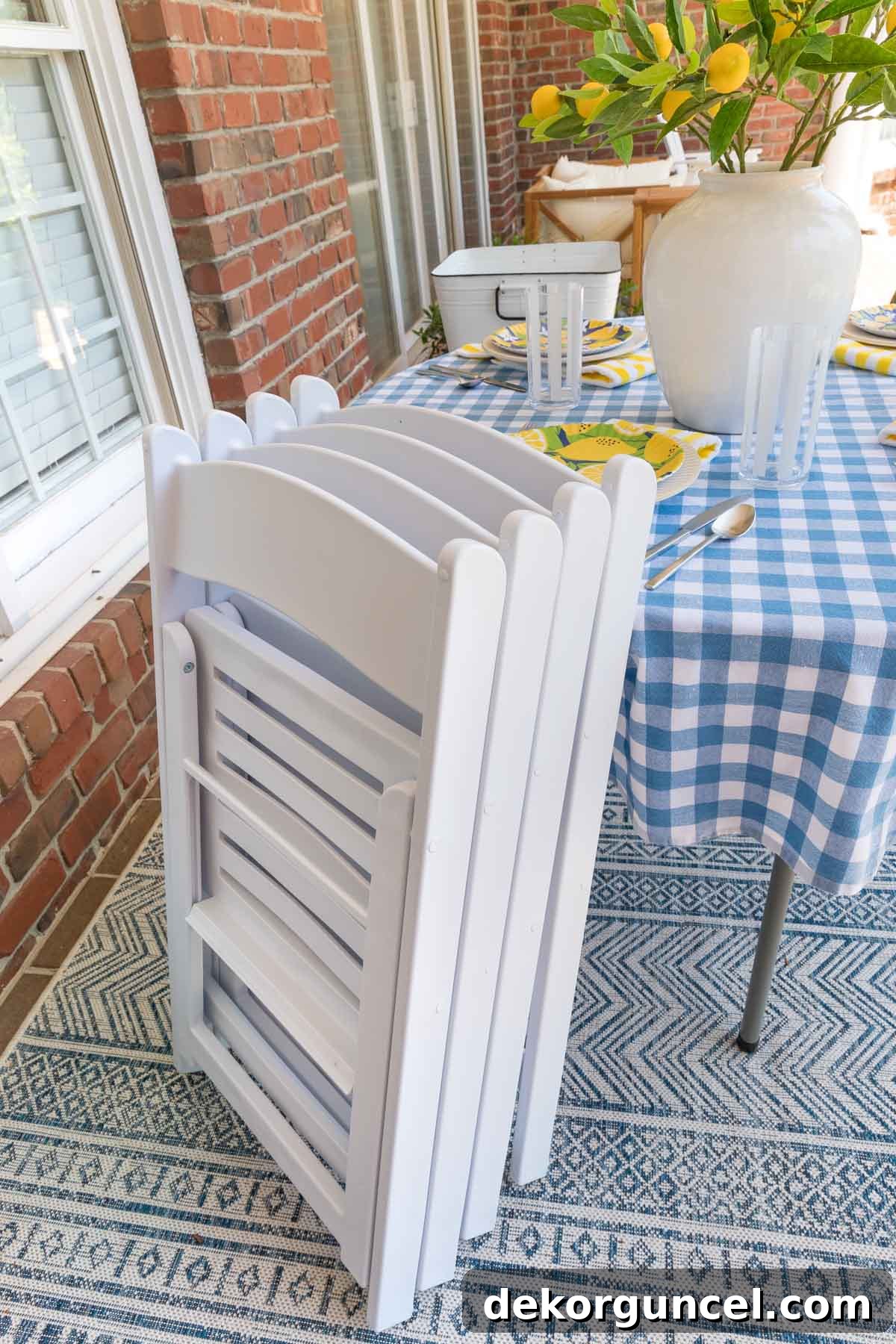 Stack of neatly folded outdoor chairs, demonstrating efficient space-saving storage solutions for patios.