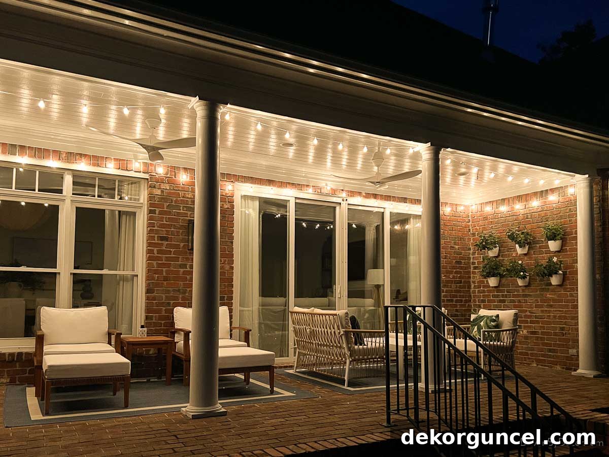 String lights beautifully outlining the perimeter of a covered porch, creating a warm evening ambiance.