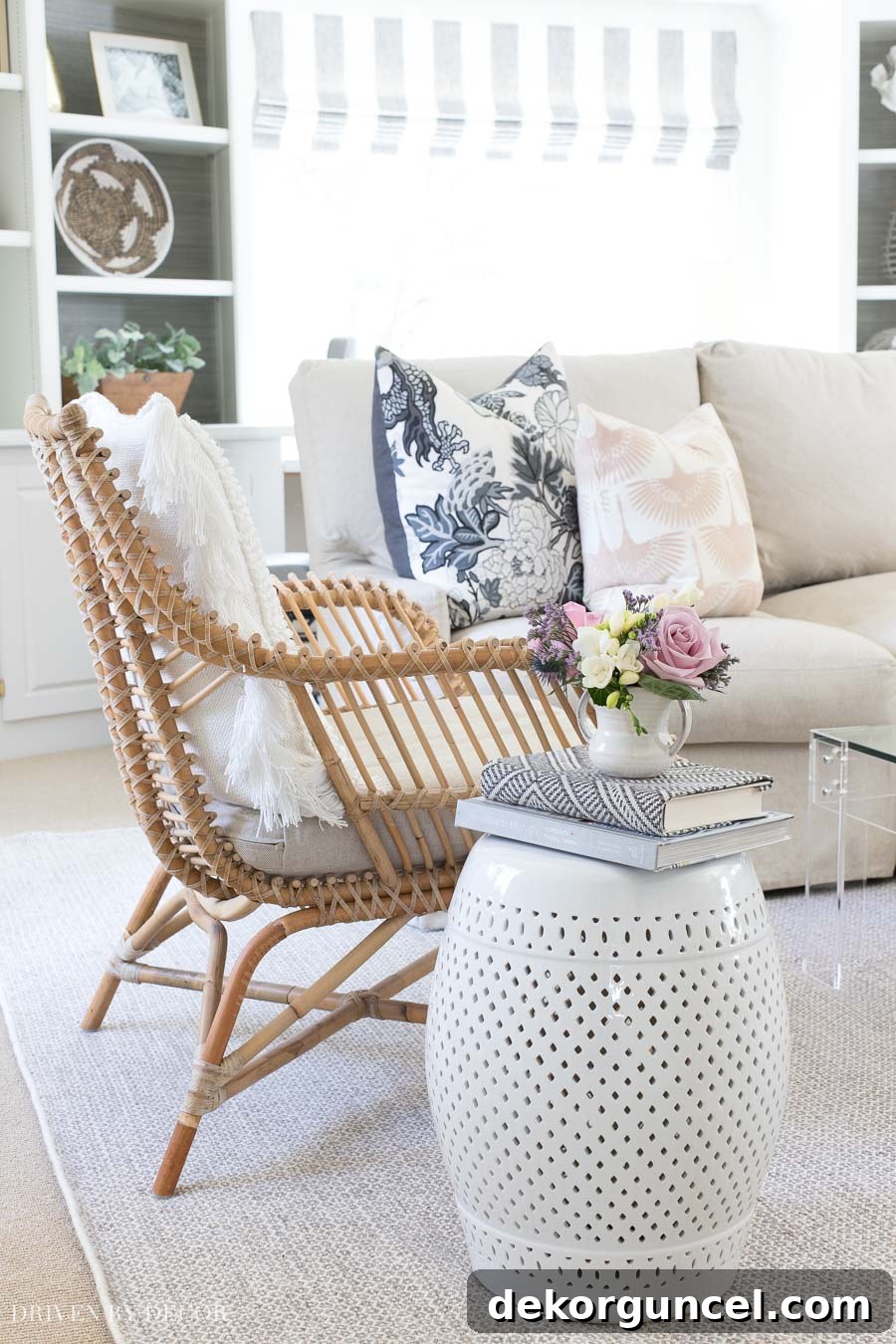 White ceramic garden stool with diamond cut-out pattern, serving as a versatile side table indoors and out.