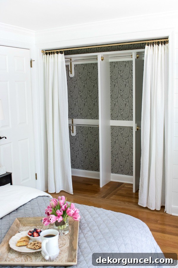 Beautifully transformed closet with drapes replacing bi-fold doors, showcasing a wide opening and stylish interior design.