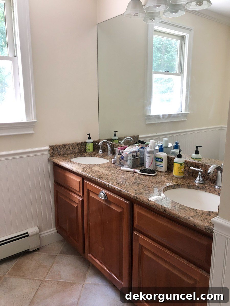 My Top 10 DIY Home Projects 11 Side-by-side 'before' and 'after' images showcasing the dramatic transformation of a bathroom vanity after being painted, illustrating a successful DIY refresh.
