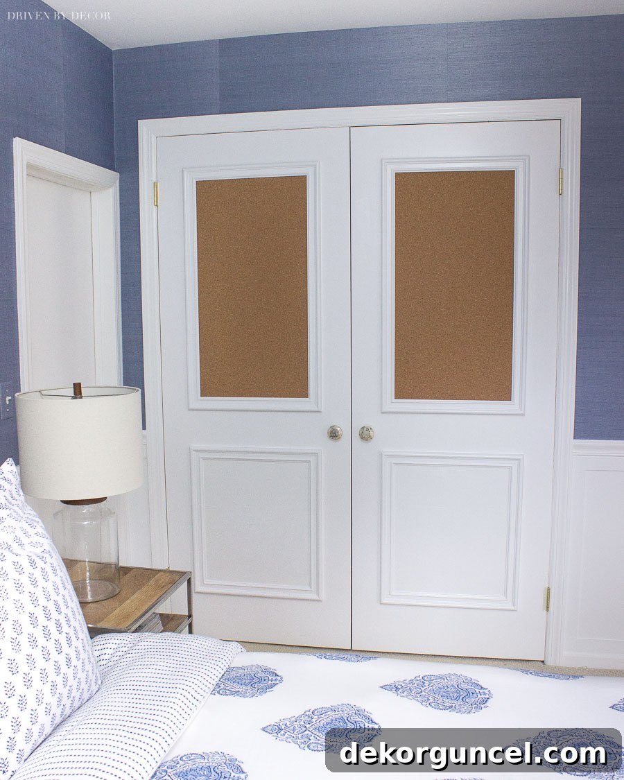 My Top 10 DIY Home Projects 22 A creative closet door makeover featuring added box molding and integrated cork boards in the top two panels, providing both decorative appeal and functional pinning space.
