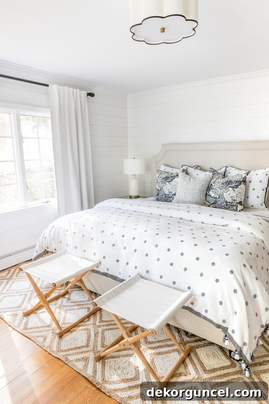 My Top 10 DIY Home Projects 10 After image of a master bedroom showcasing beautiful DIY shiplap walls, painted white, providing a fresh, modern farmhouse aesthetic that transformed the space.