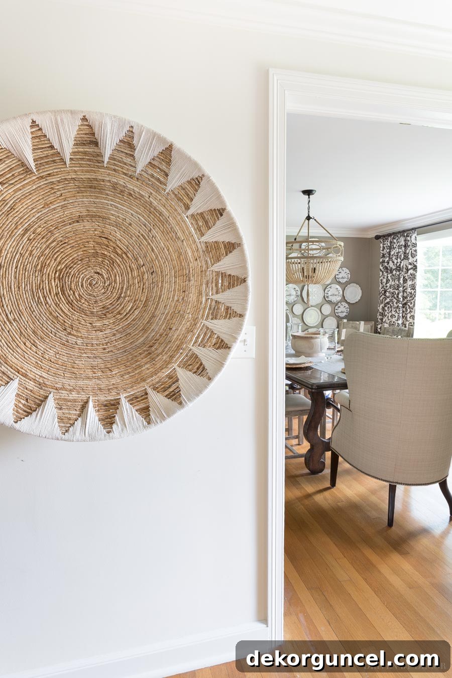 A hallway featuring a large, beautiful woven wall basket hung as decorative art, enhancing warmth and texture.