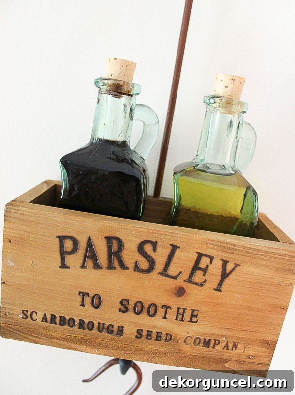 This cute hanging wooden herb box is perfect for holding tabletop essentials like oil and vinegar bottles!