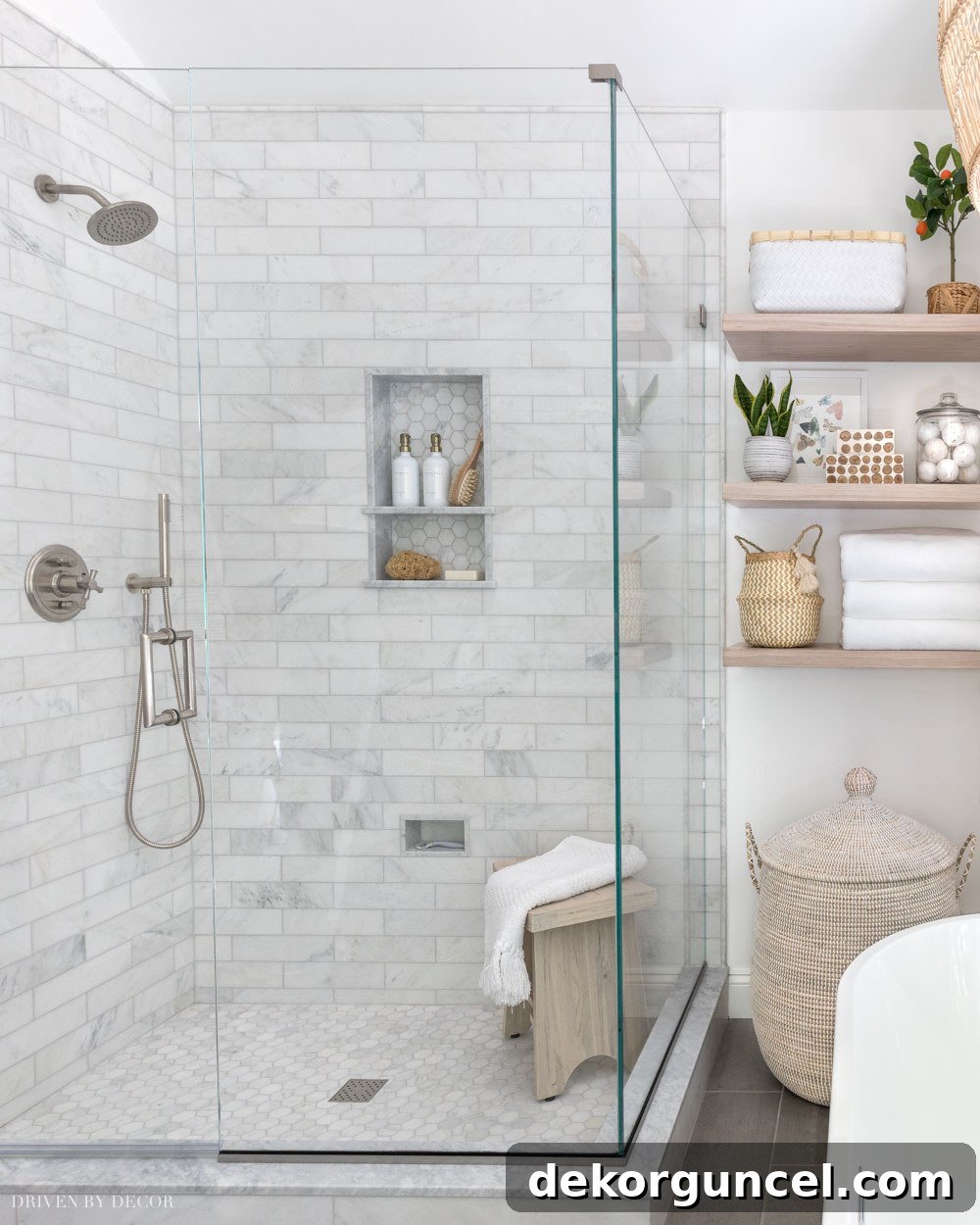 Expertly mixed metals featuring brushed nickel shower hardware complemented by elegant brass accents throughout the bathroom.