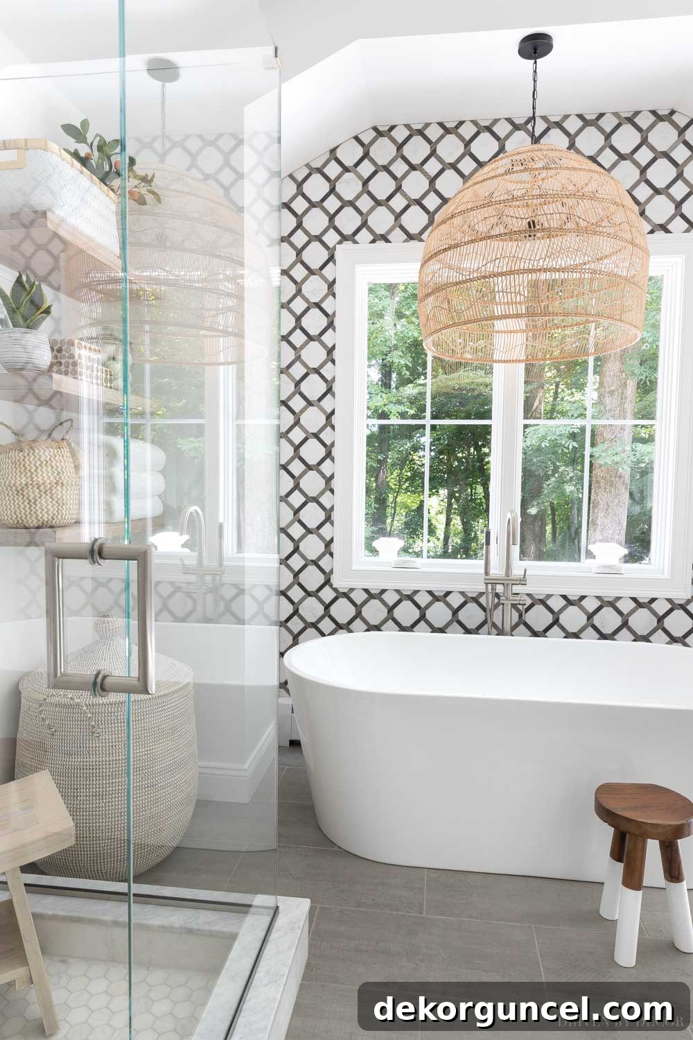 A sophisticated mix of brushed nickel, brass, and dark bronze metals creates a harmonious and inviting bathroom design.
