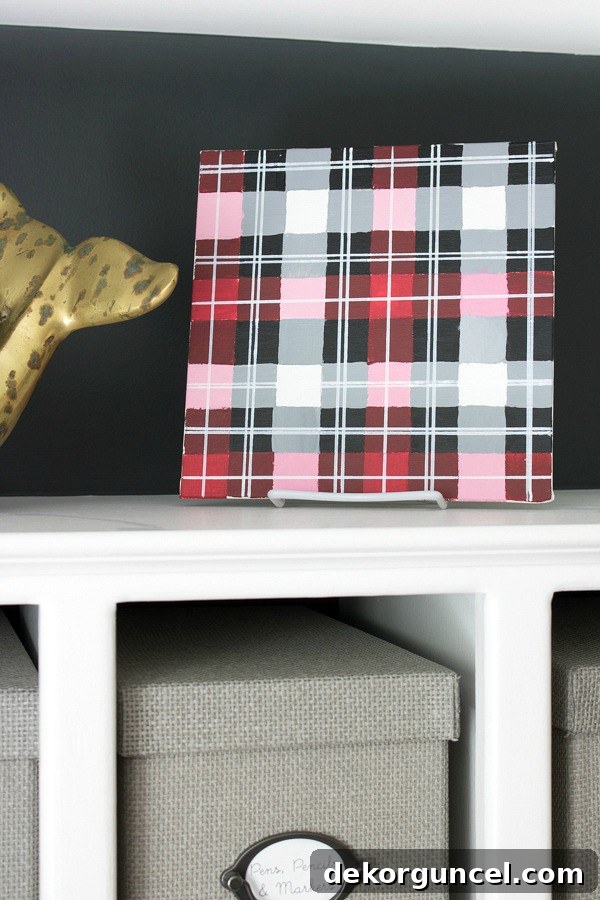 Unleash Your Inner Artist 5 Simple Projects 9 Vibrant DIY plaid art, meticulously crafted with painter's tape, various paints, and paint pens. A creative and personalized home decor idea!