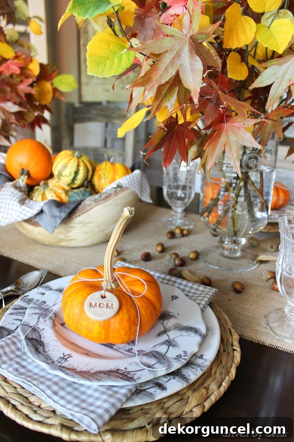 Easy to make dough tags tied onto mini pumpkins are part of this pretty fall tablescape