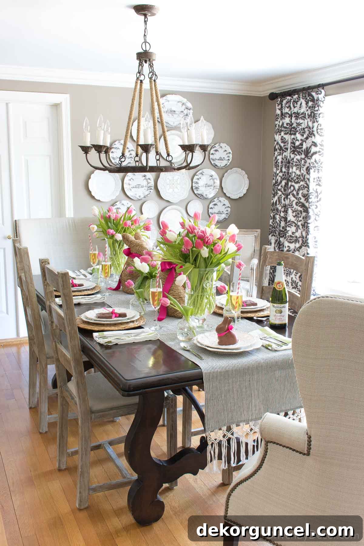 Easter table with vases of tulips and bunny decor