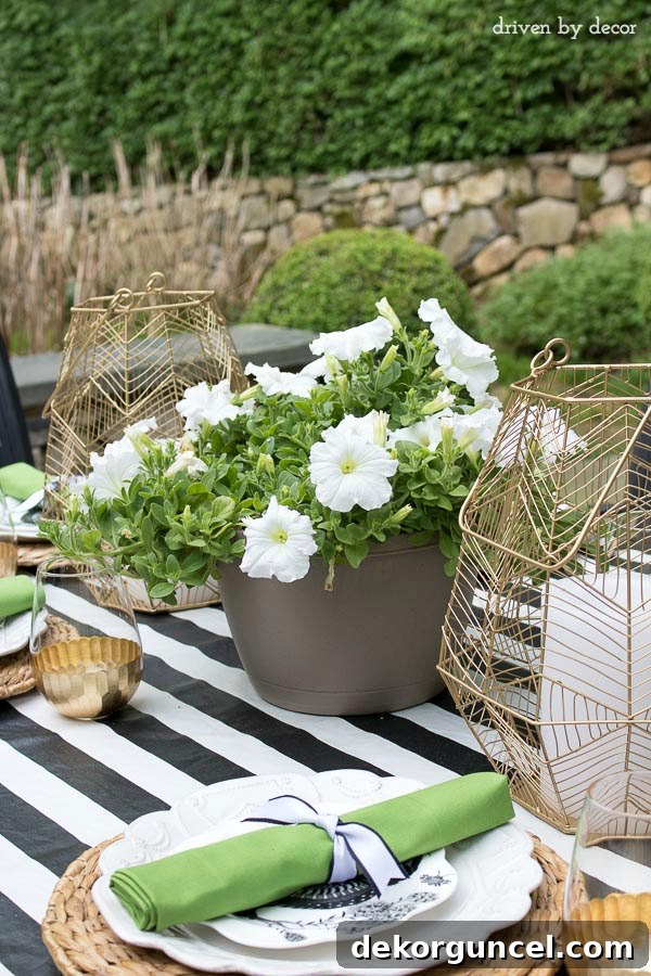 Use a hanging planter as a simple outdoor dining centerpiece! One of the tips for simplifying summer in this post!