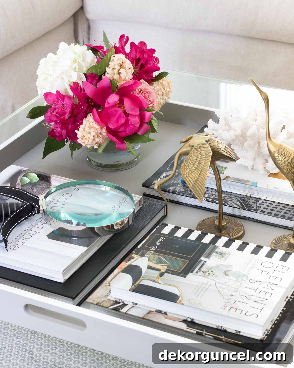 Stylish stacks of coffee table books providing height and visual interest in coffee table decor.