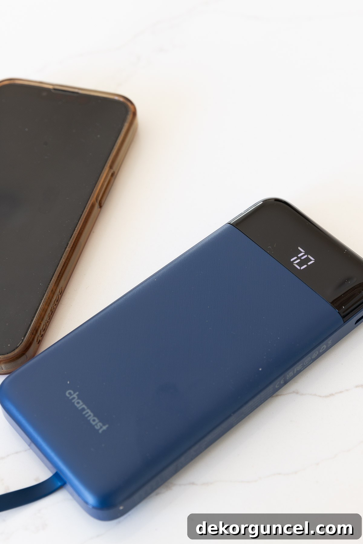 Portable power pack actively charging a smartphone, displaying battery life.