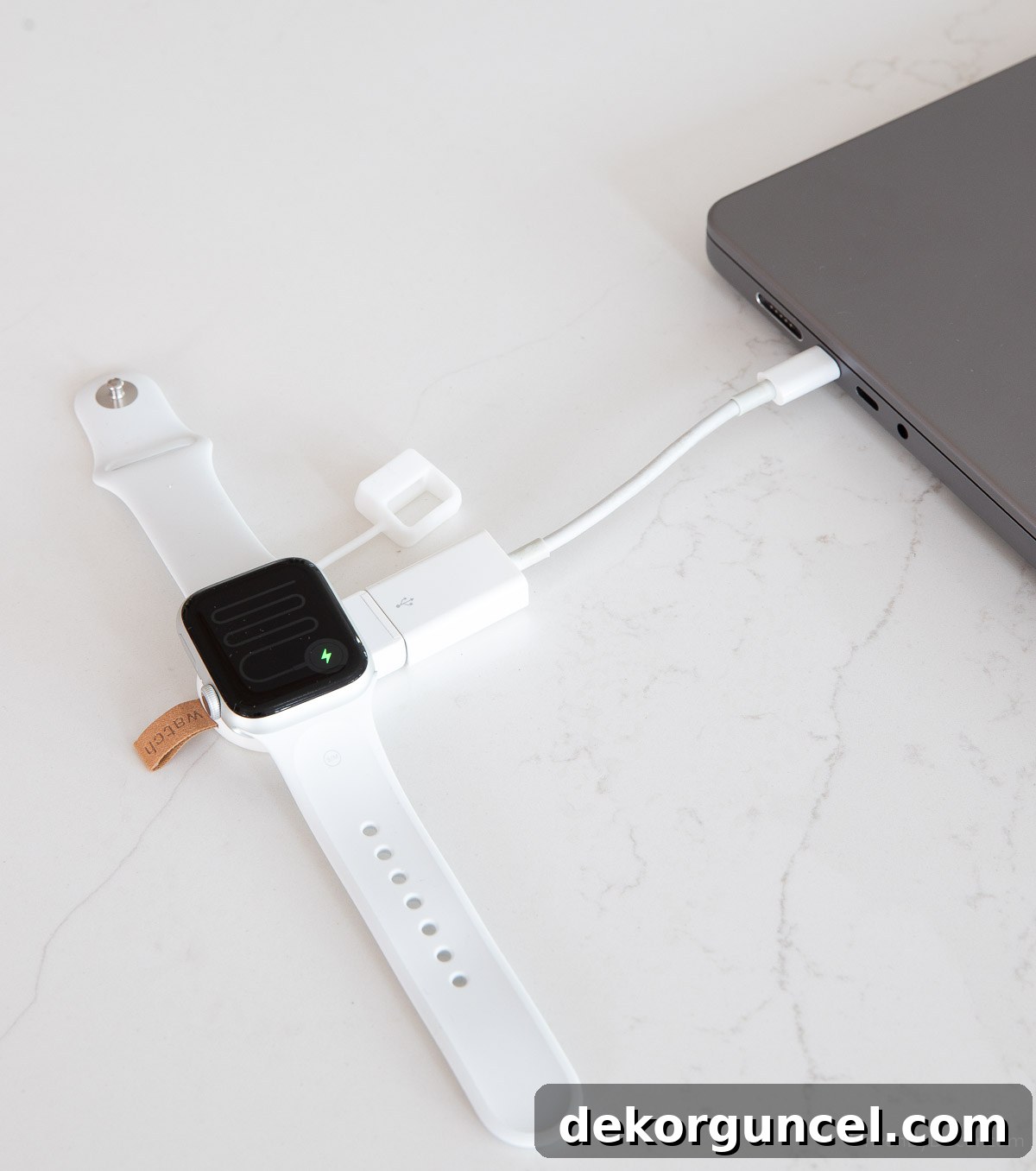 Compact Apple Watch charger plugged into a power bank, presented as an excellent Christmas gift idea.