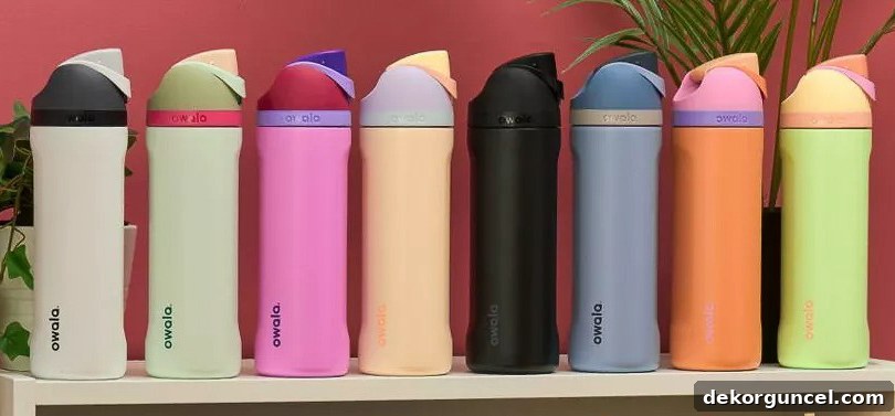 A collection of colorful Owala water bottles, popular among young adults.